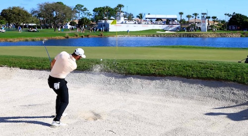 A greenside bunker guarding the edge of a putting green