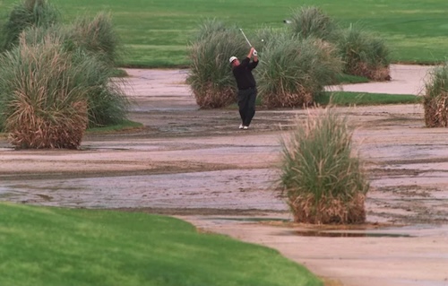 A large sprawling waste bunker area on a desert course