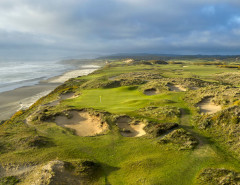 Towering sand dunes lining a links hole