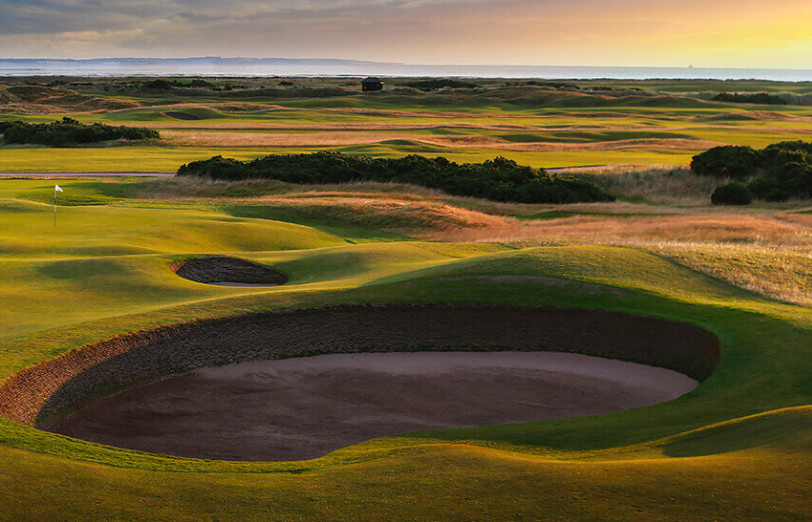 A deep revetted pot bunker on a links course