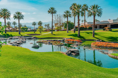 A lakeside green on a tropical resort course